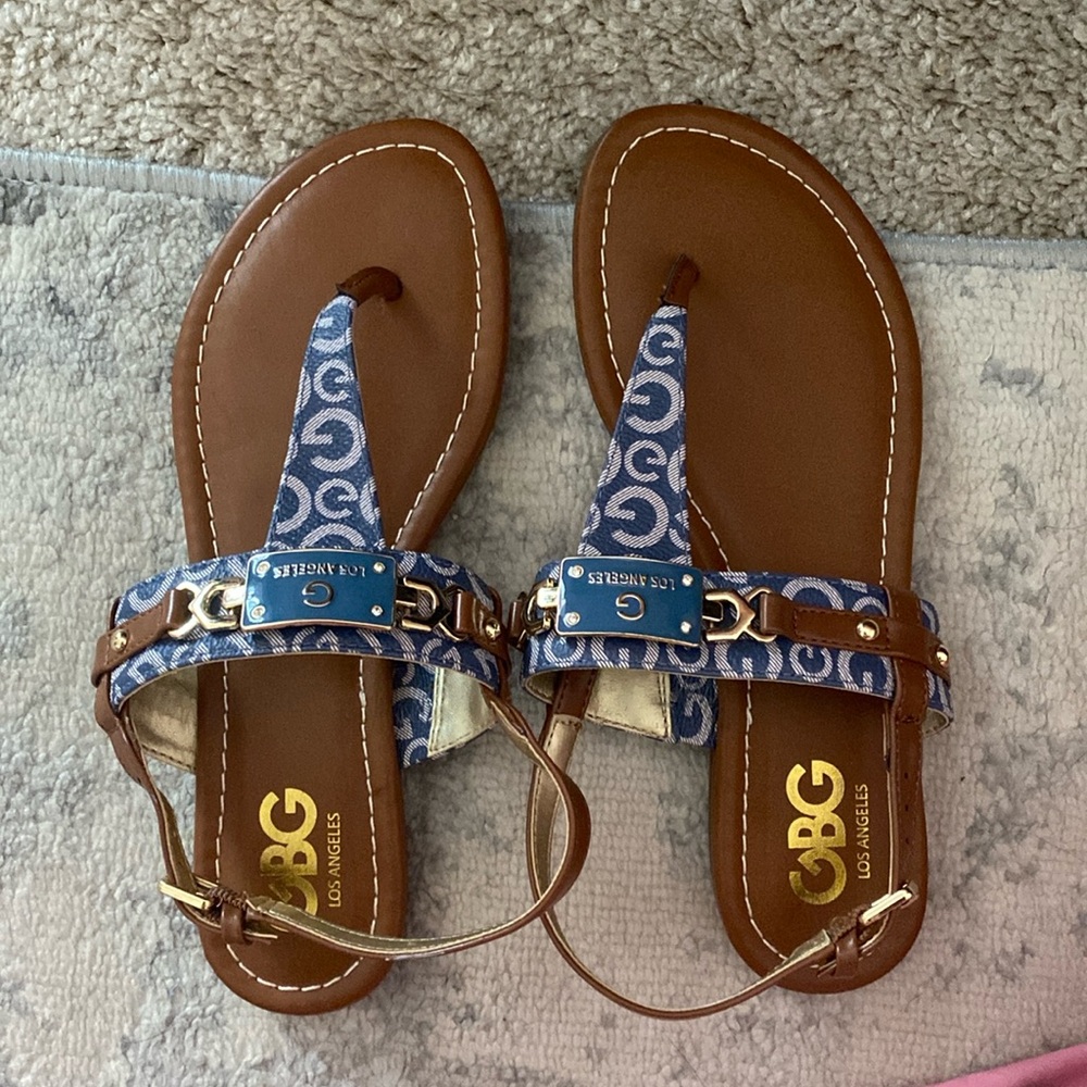 Cute Guess sandals, size 6.5 never worn. They’re too small for me :(